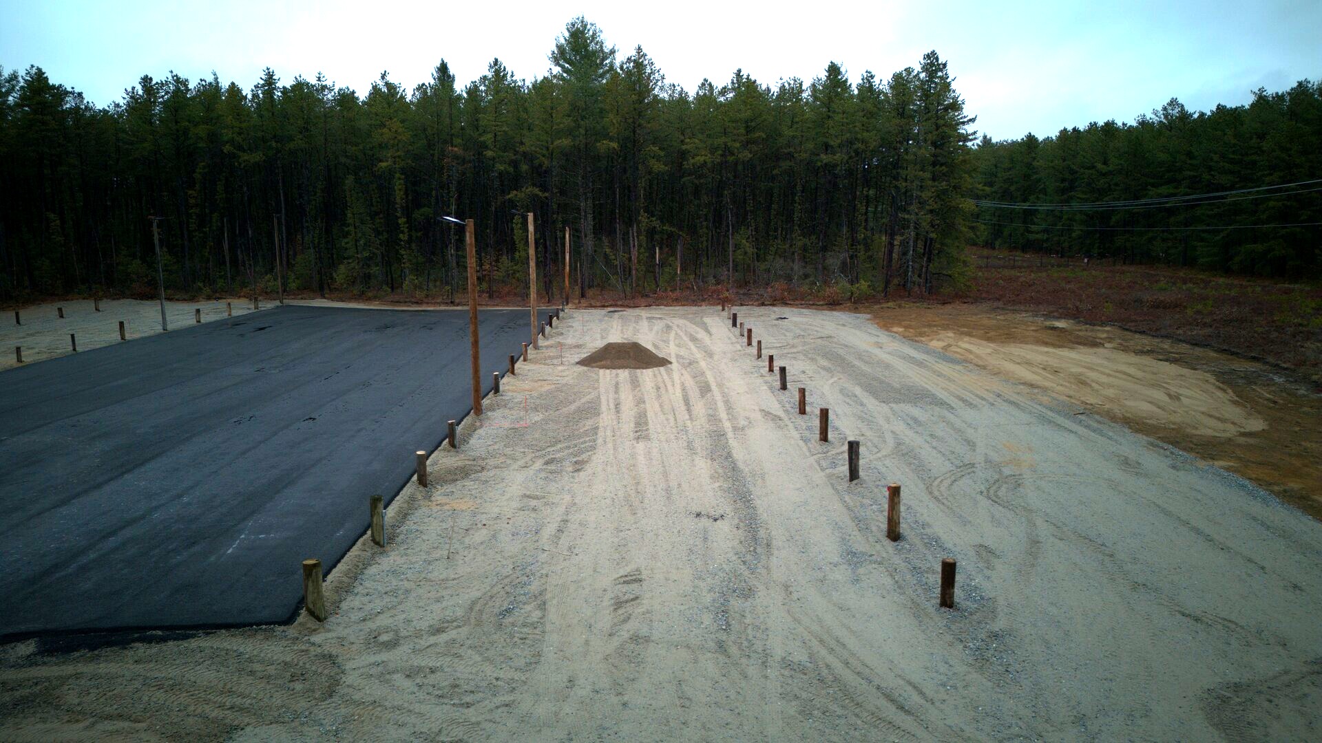 Aerial view showing parking lot layout with marked spaces